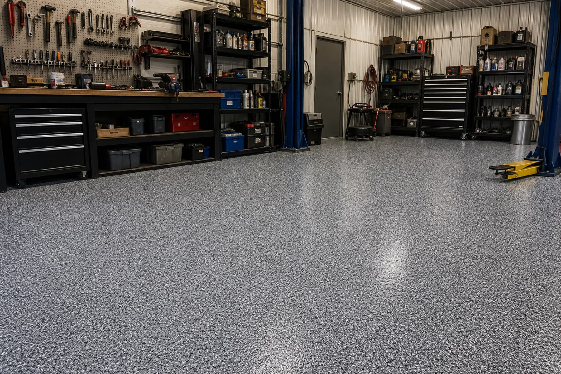 Durable gray flake concrete coating in a small commercial shop floor Durable gray flake concrete coating in a small commercial shop floor